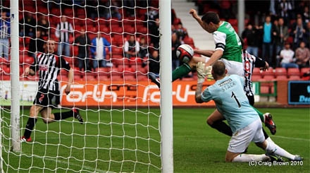 Paul Hanlon diverts the ball into his own net giving Hibs keeper Graham Stack no chance.