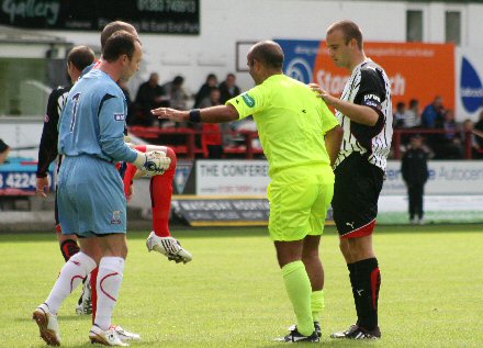 Referee Anthony Law is carried off