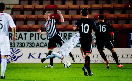 Joe Cardle goes over in the box