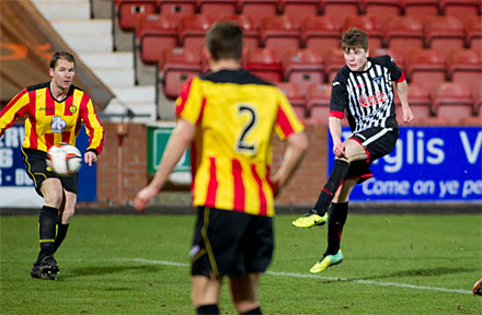 Alex Whittle fires at Thistle goal